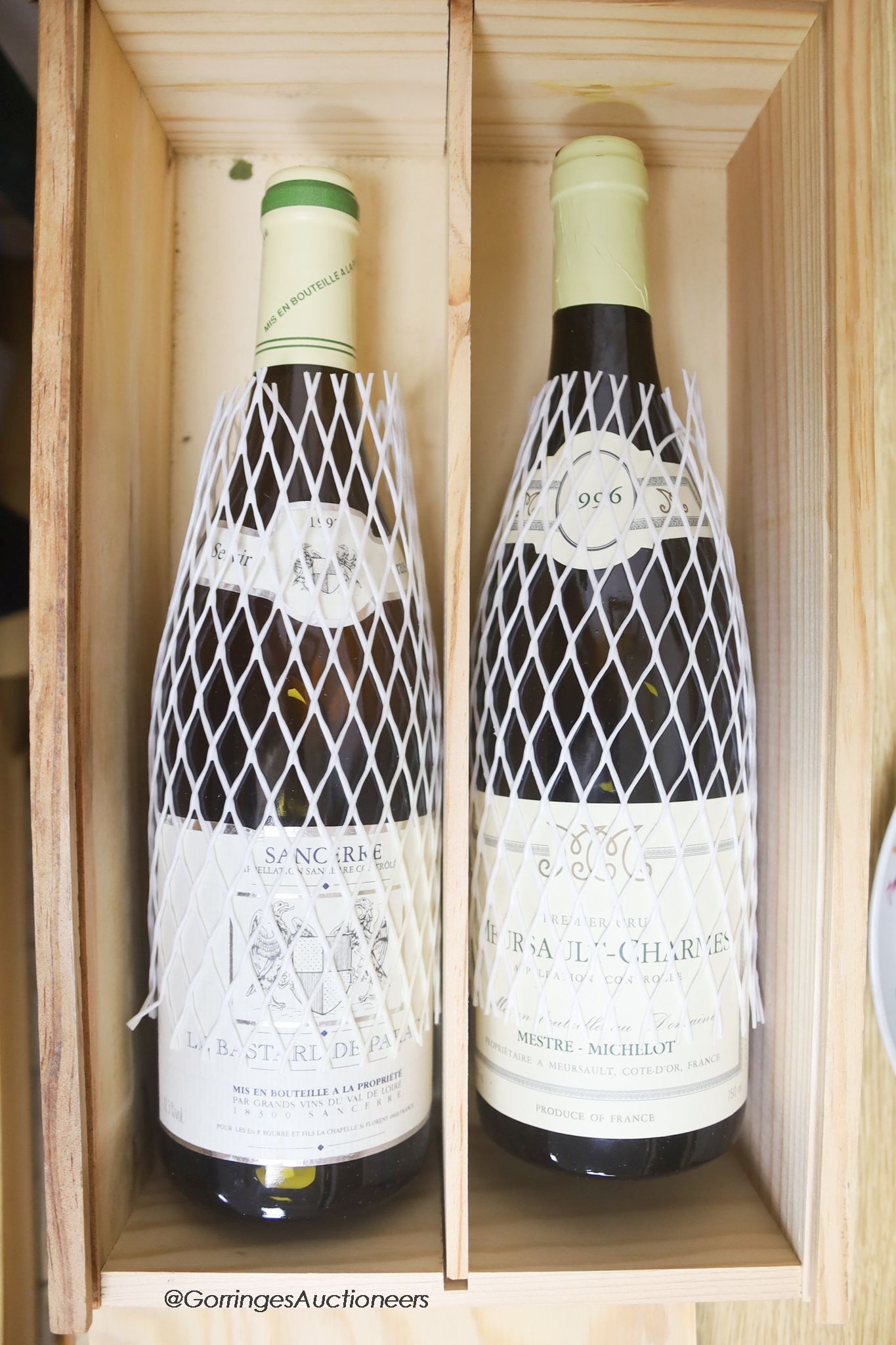A bottle of Sancerre 1997 and a bottle of Meursault-Charmes 1996